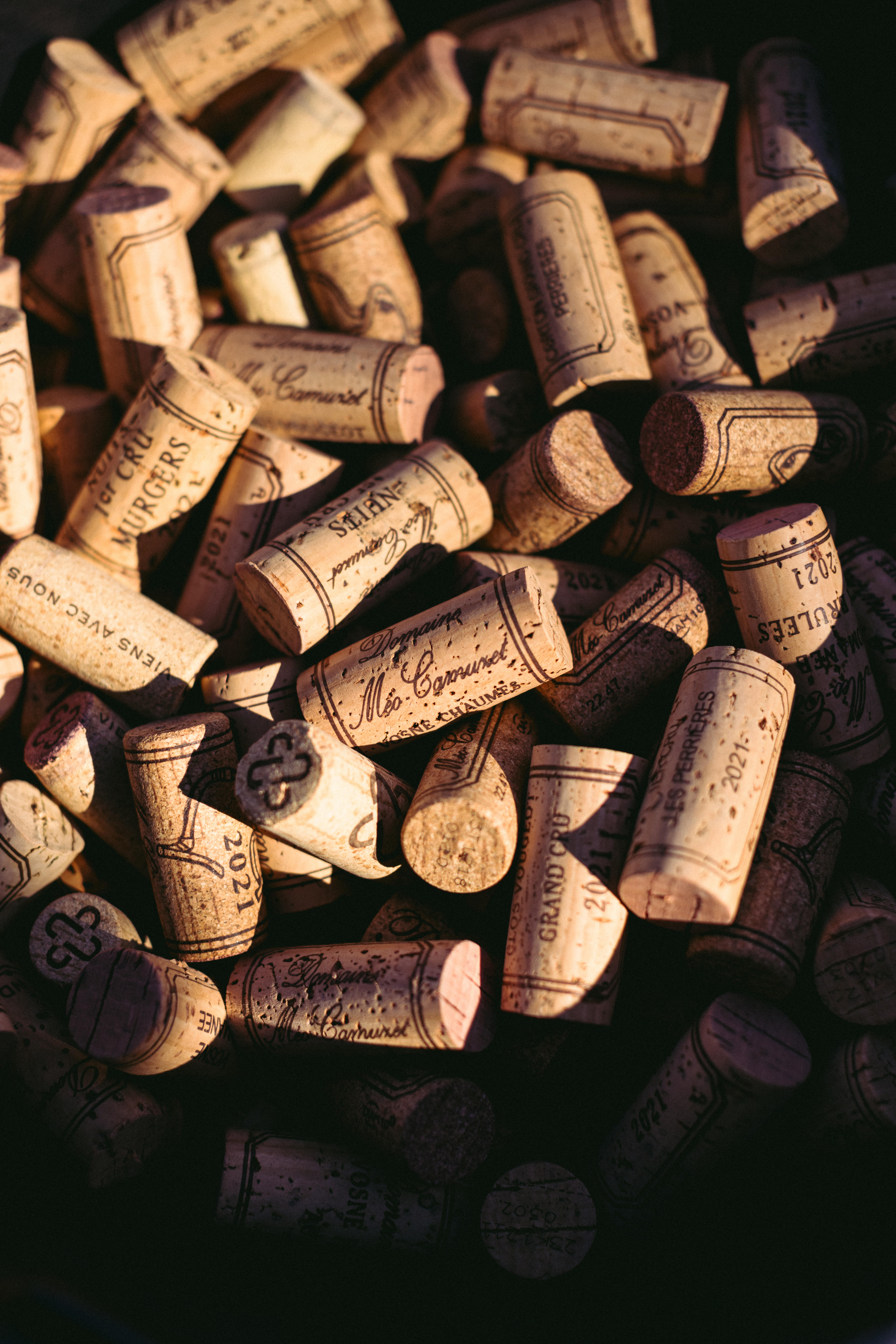 A pile of corks bearing the name Méo-Camuzet