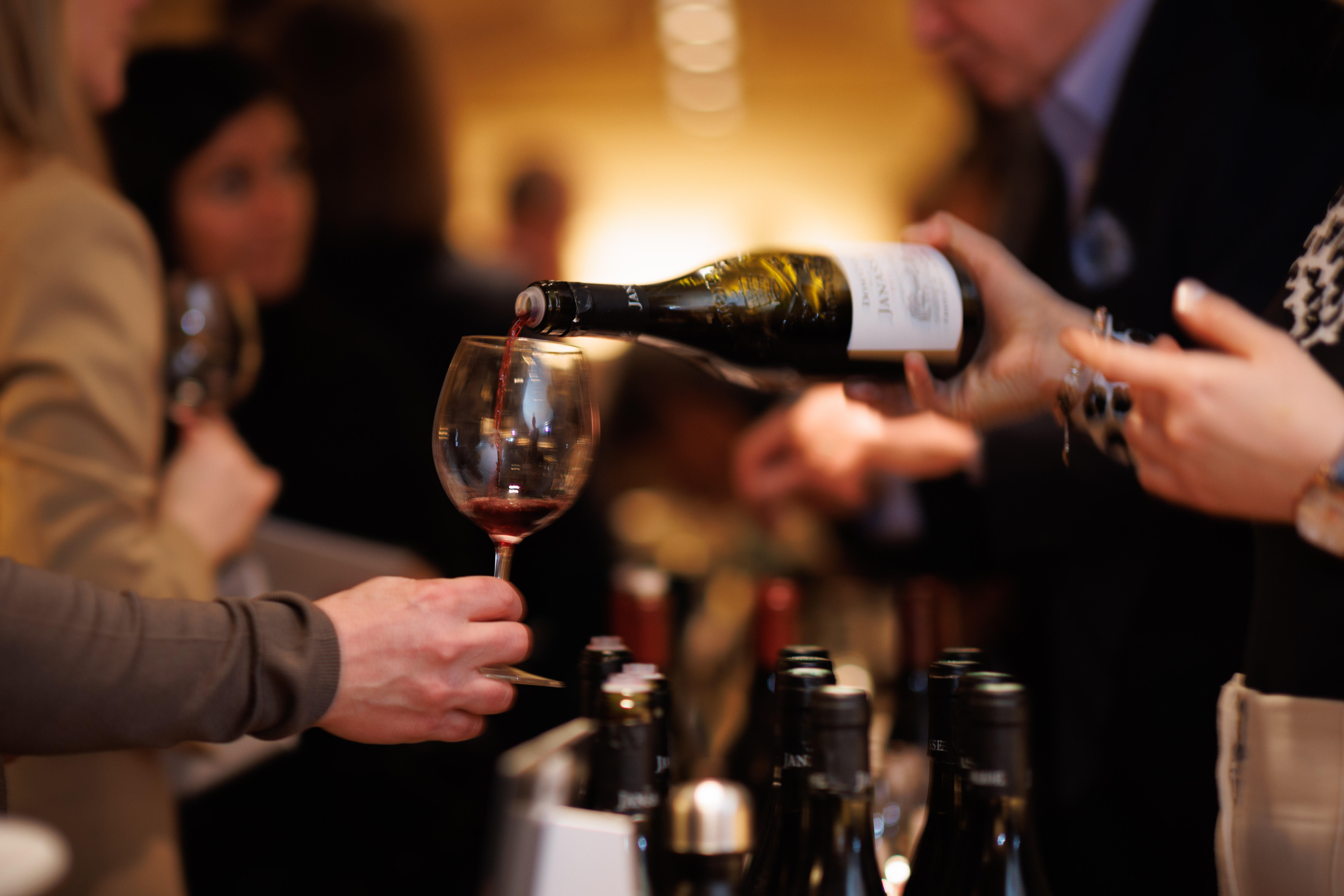 Four bottles of Bordeaux red wine from Pauillac, vintage 2005, displayed on a marble surface. Labels visible: Château Lafite Rothschild, Château Mouton Rothschild, Les Forts de Latour, and Château Pontet-Canet.